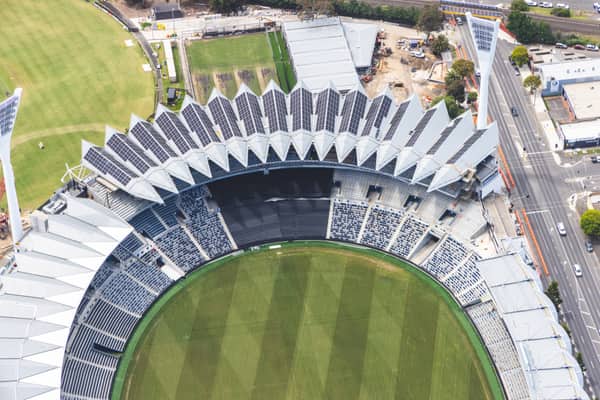 Aerial view of GMHBA Stadium at Kardinia Park in South Geelong, showing the oval, tiered seating, roof structures, nearby construction works and Moorabool Street.