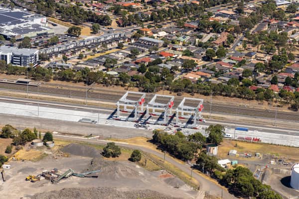 Aerial view of rail-mounted gantry cranes under construction at the Somerton Intermodal Terminal beside the Melbourne-Sydney freight line in Somerton, Victoria.