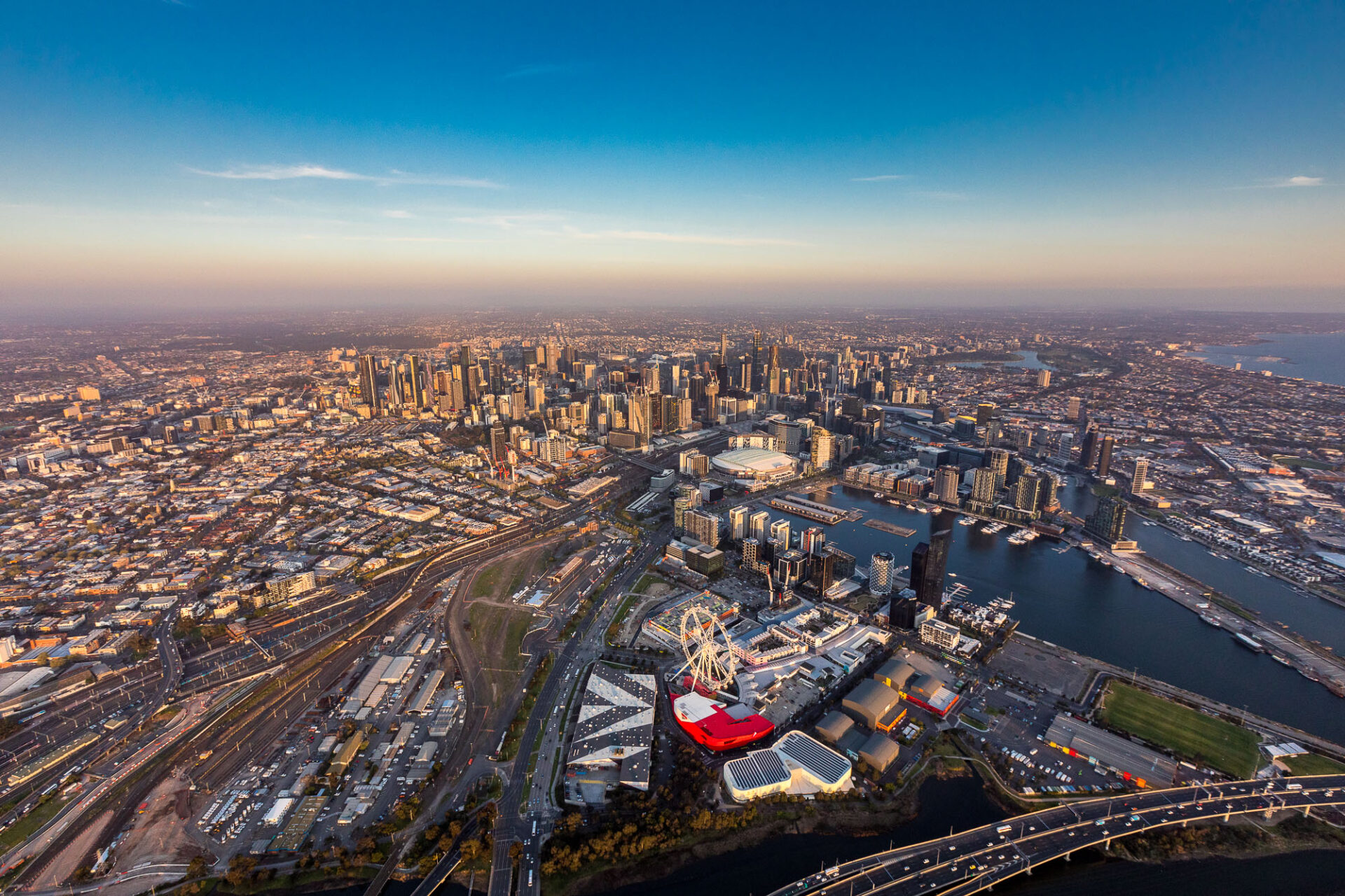 Aerial view of Melbourne CBD and Docklands at sunset, captured by Aerial Now