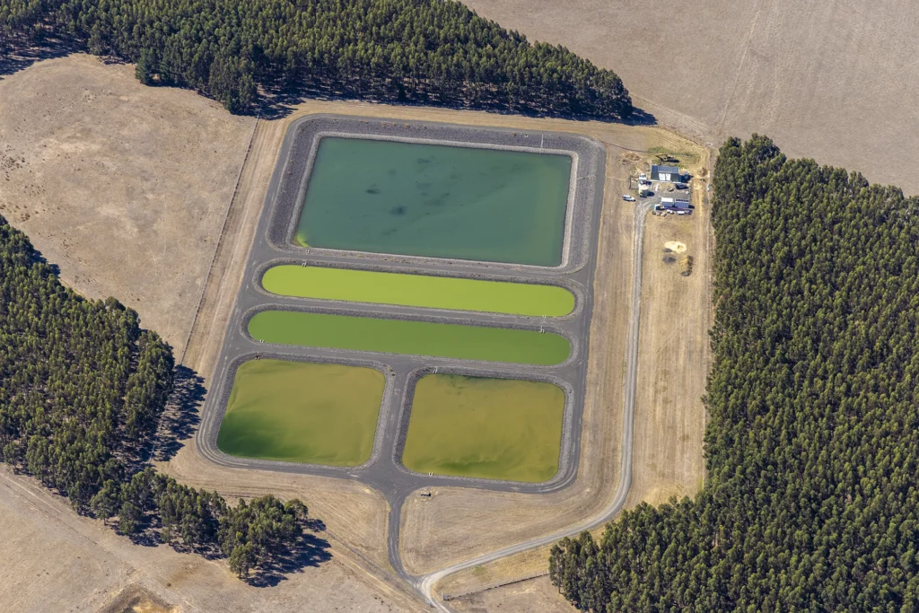 High-resolution aerial photograph of a water treatment utility asset with multiple settling ponds, captured for condition monitoring, asset inspection, and corporate reporting for a Victorian water company.